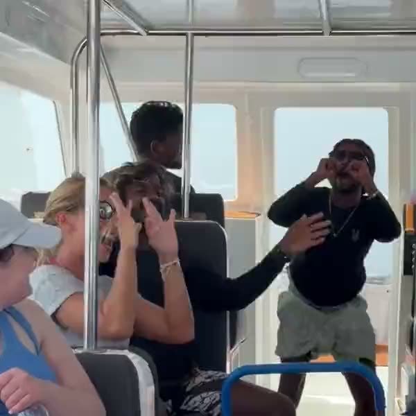 The group celebrating on the boat between excursions